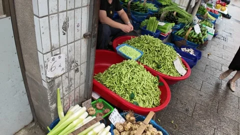 Fresh Green Beans Fill Red Baskets at Shanghai Produce Market Stock Footage 340176651