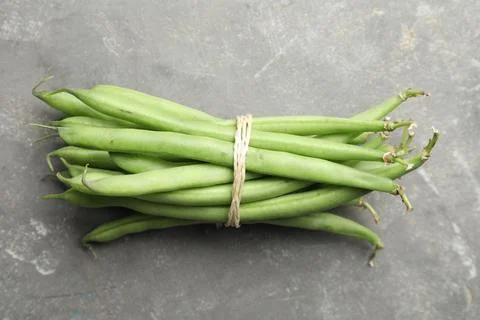 Fresh green beans on grey table, top view Stock Photos