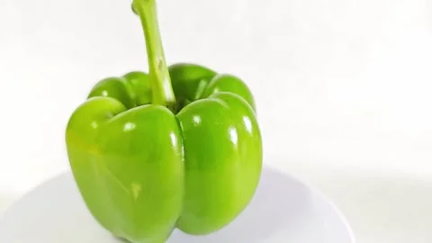 Fresh green bell pepper isolated on white background. Stock Footage 340938091