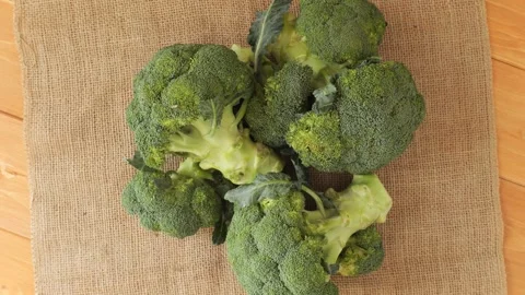 Fresh green broccoli rotating on burlap Stock Footage 337441118