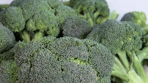 Fresh green broccoli is spinning on the table Stock Footage 304518048