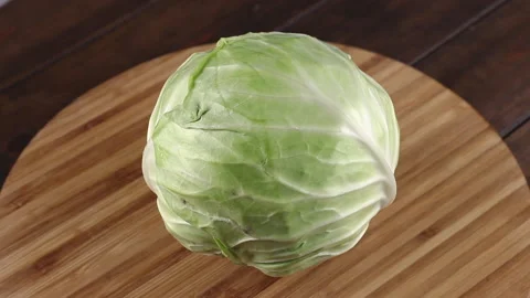 fresh green cabbage rotating close-up on... | Stock Video | Pond5