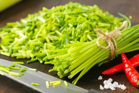 Fresh green celery chopped on cutting board Stock Photos