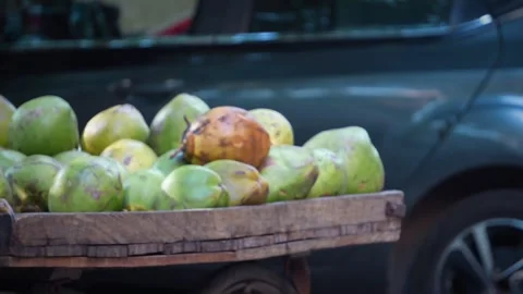 Fresh green coconuts ready for sale at a roadside stall, tender coconut wat.. Stock Footage 346729863