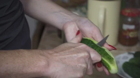 Fresh green cucumber cleaned and cut with a knife Stock Footage 110474337
