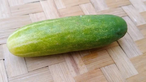 Fresh Green Cucumber Placed on Rustic Bamboo Background Stock Footage 340125555