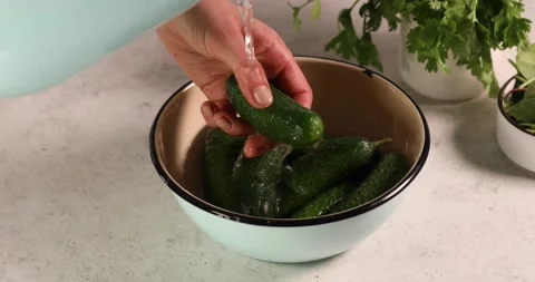Fresh green cucumber vegetable fruit in white bowl washing Stock Footage 194105202