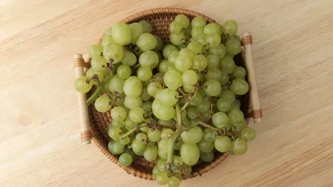 Fresh green grapes rotating in a basket Stock Footage 346986053
