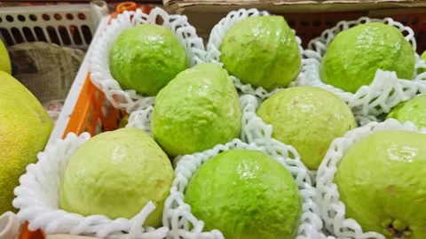 Fresh green guava or custard apple on display on local fruit market selling.. Stock Footage 264618052