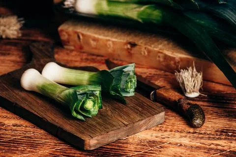 Fresh green leek on cutting board Stock Photos