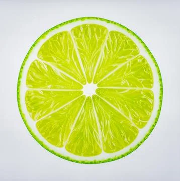 Fresh Green Lime Slice Isolated on White Background Representing Tropical C.. Stock Photos