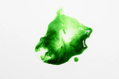 Fresh green liquid spill or splat with bubbles on a white background Stock Photos