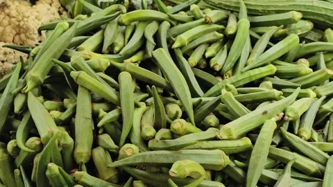 Fresh Green Okra Vegetable Display at Local Market for Healthy Cooking Video stock 337874658