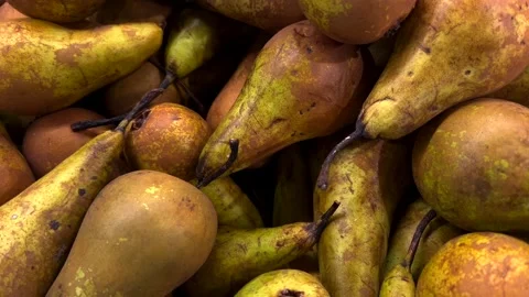 Fresh green pears on a fruit texture background Видео 332399779