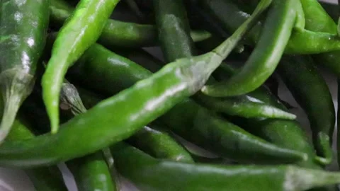 Fresh green peppers moving on table Stock Footage 338160897