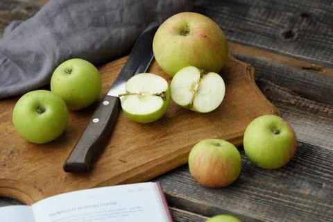 Fresh green rustic apples on a grey background Stock Photos