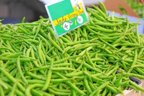 Fresh green string beans displayed for sale at the Farmers' Market. Stock Photos