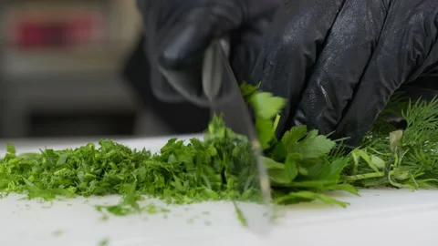 Fresh greens salad lettuce on the table in the kitchen. Cook at home. Healthy Stock Footage 144734634
