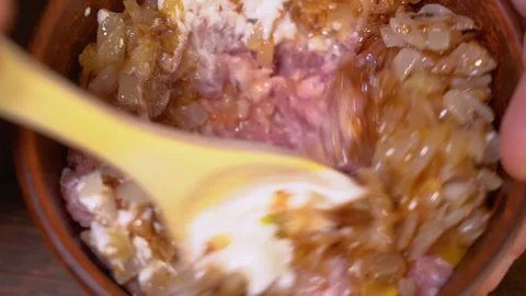 Fresh ground beef mixed with fried onions Stock Footage 249731774