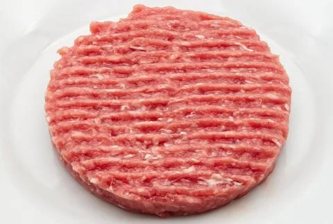 Fresh ground beef patty ready for grilling Stock-Fotos