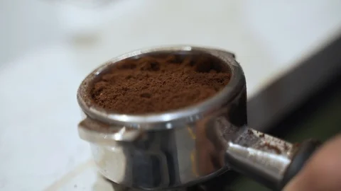 Fresh grounded espresso beans being pressed ready for the espresso Stock Footage 122362638