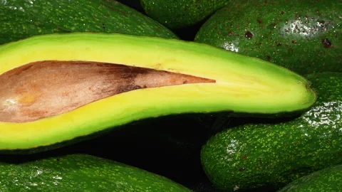 Fresh Half Avocado Long Shape Slice with Seed Close Up Stock Footage 336491883