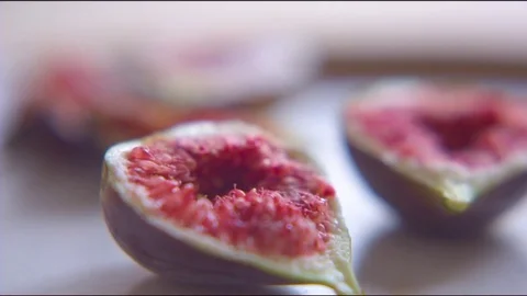 Fresh halved figs in plate Stock Footage 76136489