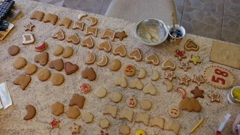Fresh handmade gingerbreads are on the table. Day, indoors, natural light, kitch Stock Footage 83518761