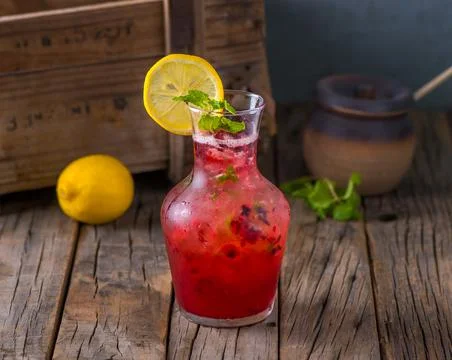 Fresh healthy SPARKLE juice Raspberry Mojito Lemonade with raw fruit served i Stock Photos