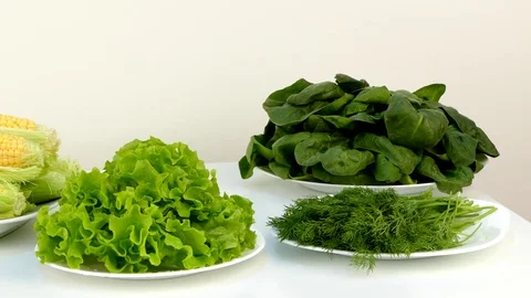 Fresh healthy vegetables in plates on a table. Video stock 84592341