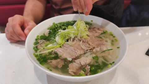 Fresh herbs in Lean Pho Bo make taste very light. Every Lean Pho Bo with sliced Video stock 326281407