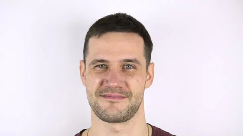 Fresh herring hits the face of a young attractive guy. Stock Footage 148437182