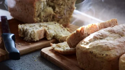 Fresh home made baked bread, whole grain organic food, hot steaming food Video stock 260276736