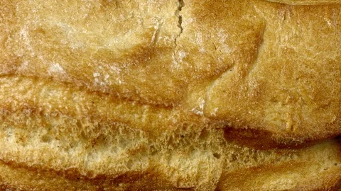 Fresh homemade bread being broken up, in a bakery. Stock Footage 99743640