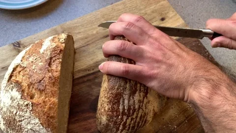 Fresh Homemade Bread Being Sliced Stock Footage 134214948