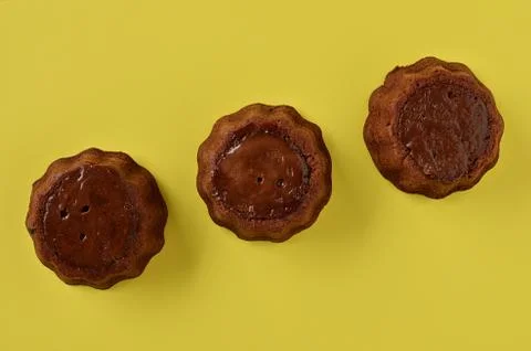 Fresh homemade chocolate brownie on a yellow background. Stock Photos