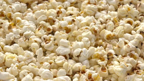 Fresh homemade popcorn full frame background texture rotating closeup. Stock Footage 342276881