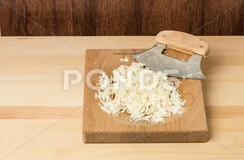 Fresh horseradish being grated Stock Photos