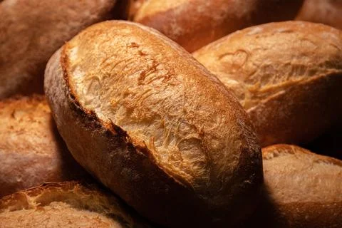 Fresh hot appetizing bread after baking in the oven. Close-up healthy and tasty Stock Photos