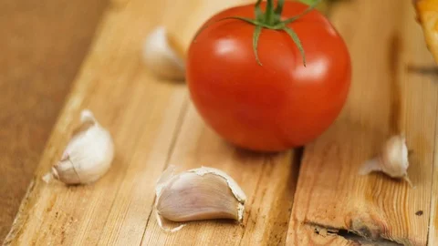Fresh hot appetizing peperoni pizza lying on a wooden plate on the table Stock Footage 106364608