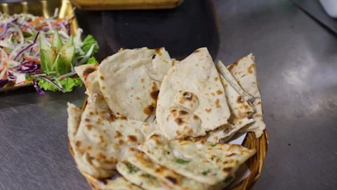 Fresh Indian Naan Bread in Baskets on Kitchen Counter Stock Footage 345784141