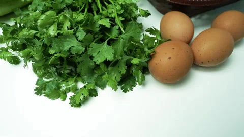 Fresh Ingredients with Cilantro and Eggs Footage, A close-up of fresh cilan.. Vídeos de archivo 305029652
