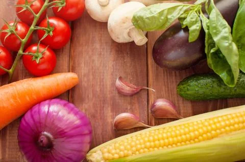 Fresh ingredients for cooking in rustic setting: tomatoes, basil, olive oil Stock Photos