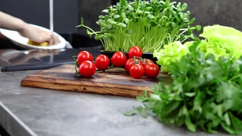 Fresh ingredients inspire culinary creativity in a modern kitchen Vídeos de archivo 296313030