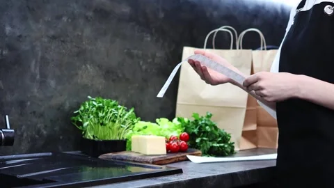 Fresh ingredients inspire culinary creativity in a modern kitchen setup Vídeos de archivo 296315911