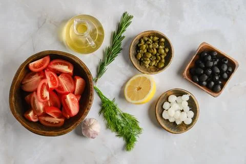 Fresh ingredients on a kitchen counter for preparing a healthy salad with h.. Stock Photos