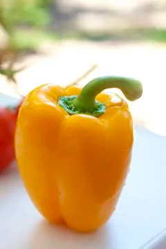 Fresh Inviting Orange Pepper on Table Stock Photos