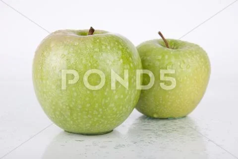 Fresh Juicy Green Apples on white Stock Photos