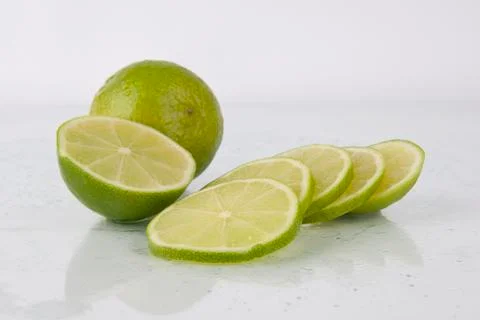 Fresh juicy limes on white Stock Photos