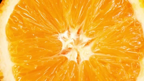 Fresh juicy orange slice rotating showing pulp and texture Video stock 332282964
